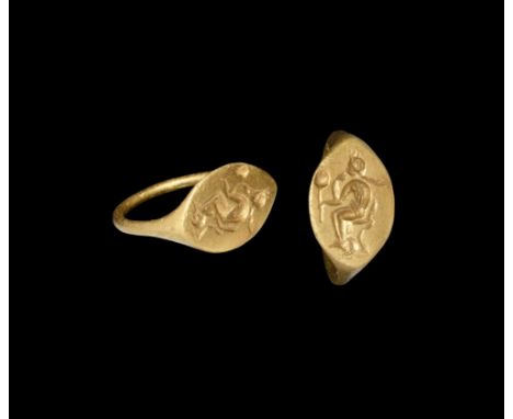 2nd-1st century BC. A gold finger ring with narrow hoop, scaphoid bezel with intaglio of Aphrodite (Roman Venus) seated with 