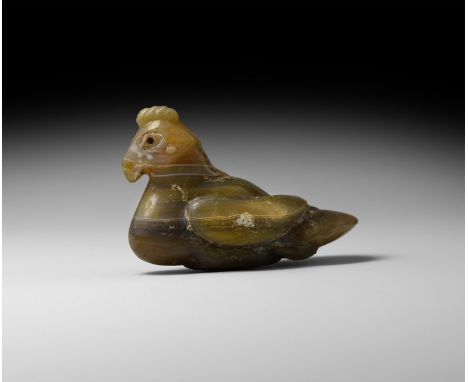 16th-18th century AD. A carved agate figure of a bird (dove?) modelled in the round with ridged comb, folded wings, bulbous c