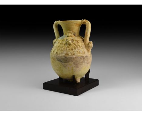 3rd century BC-3rd century AD. A ceramic jar with turquoise-coloured glaze; rotund body and basal ring formed as addorsed ox-