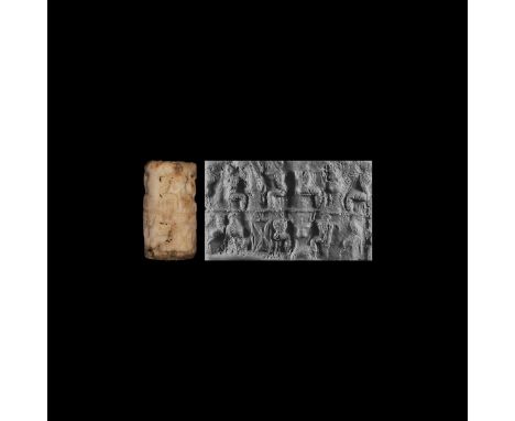27th century BC. A carved marble Early Dynastic II cylinder seal in two registers with banquet scenes; in the upper register 