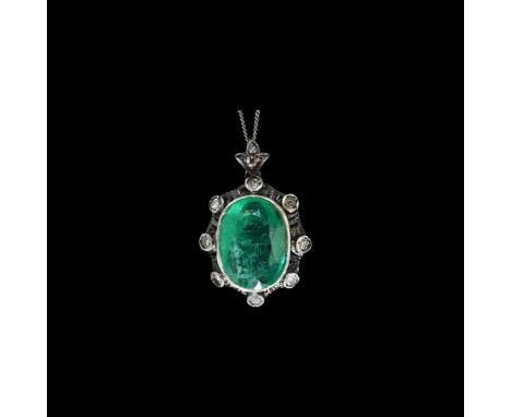 19th century AD. A silver ellipsoid pendant with openwork reverse, central inset facetted 11 carat emerald with eight inset d