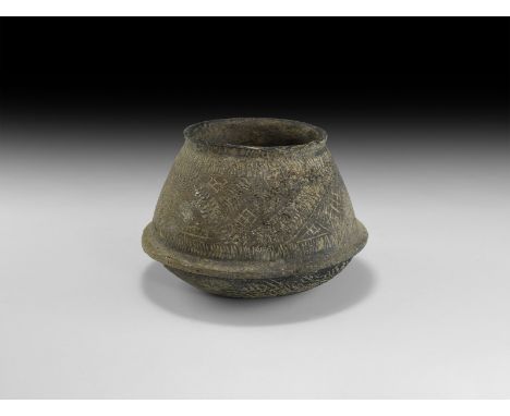 2nd millennium BC. A squat ceramic jar with rounded underside, flange rim below the shoulder and chamfered rim to the neck, b
