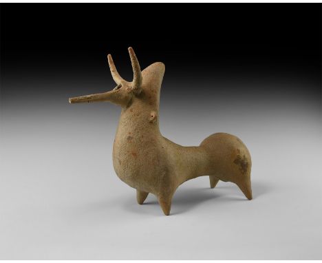 2nd millennium BC. A hollow-formed ceramic vessel of a stylised standing zebu with exaggerated body shape, lateral pierced lu