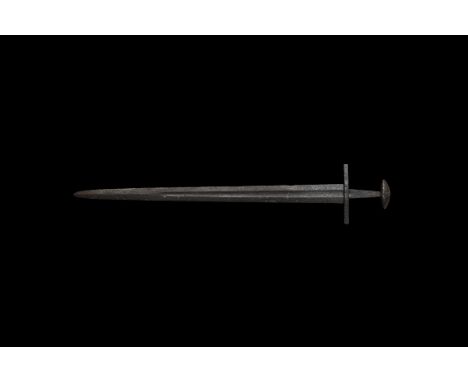 Mid 10th-early 11th century AD. A long double cutting Sword, the blade finely tapered and beautifully proportioned, thin in s