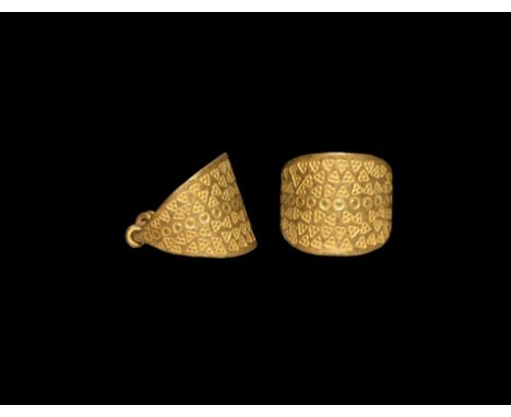 9th-12th century AD. A substantial gold finger ring comprising a broad tapering hoop with stamped decoration (pellet, pellett