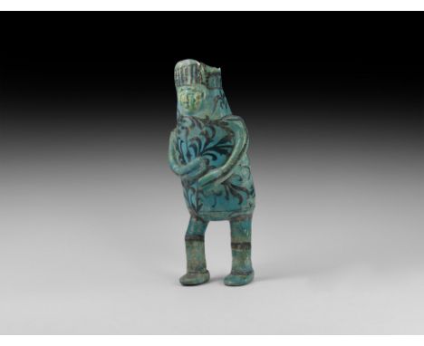 12th-14th century AD. A figural jar with ceramic (frit) body painted in black under a turquoise glaze; a male in thigh-length