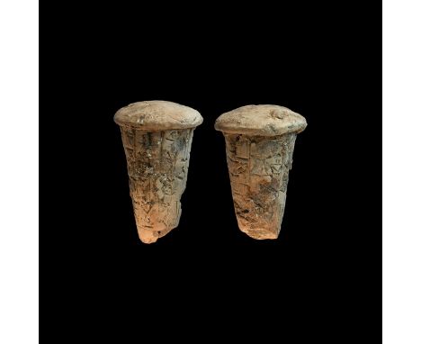 20th-18th century BC. A ceramic foundation cone with tapering body and domed top, vertical bands of cuneiform text.  266 gram