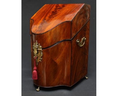 A George III flamed mahogany veneered knife box, with typical sloped top and serpentine front, brass escutcheon and handles o