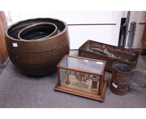 A large brass jardinière, a copper trough, brass coat hooks, a cased ships wheel, binnacle and speed control, and a set of an