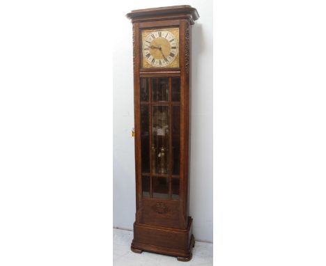 A 20th century 8-day longcase clock, with striking and chiming movement, brass square dial, silvered chapter ring, oak case w