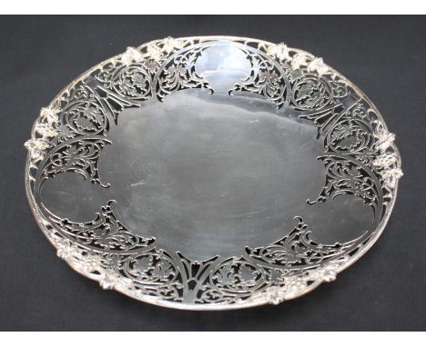 A silver fruit dish of circular form with pierced fruiting grapevine rim,, Sheffield, 1969-70, 29.5oz, 31cm diam.