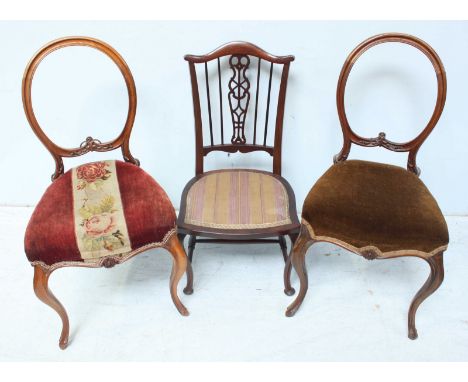 A pair of Victorian stained walnut open balloon-back standard chairs together with a stained wood stick-back low nursing chai