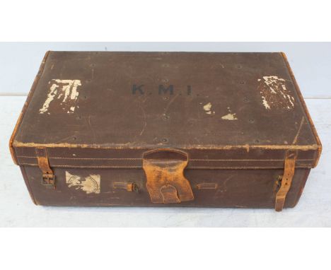 A large 1920s brown canvas travel trunk with lift-out tray