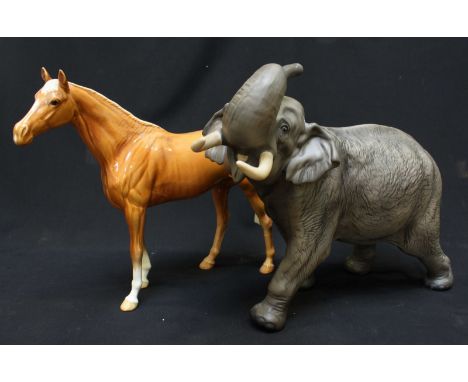 A large Beswick Connoisseur series matt grey Indian elephant, 29cm high, and a large Beswick model of a Palomino horse, 29 cm