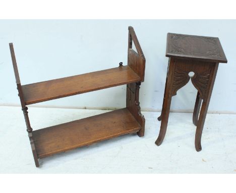 A 19th century stained oak Gothic style two-shelf hanging bookcase together with a stained oak carved jardiniere table