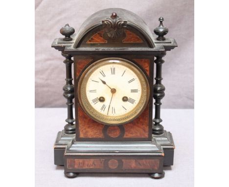 A small Victorian walnut and ebonised mantel clock, with white enamel dial and turned column sides, with Japy Freres movement