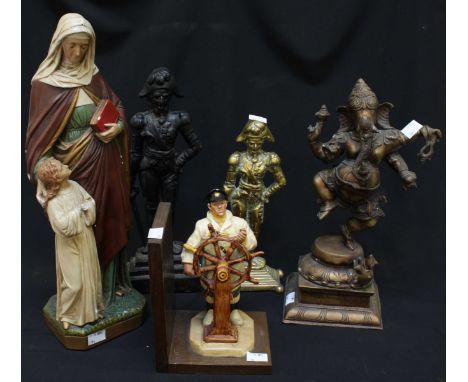 Two cast metal Nelson door stops, together with a brass model of Ganesh, a religious plaster model and a model of a sailor. (