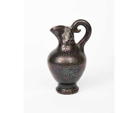 A Sunflower Pottery ewer by Sir Edmund Elton, shouldered, ovoid form with pinched neck and spout, covered in dark golden crac