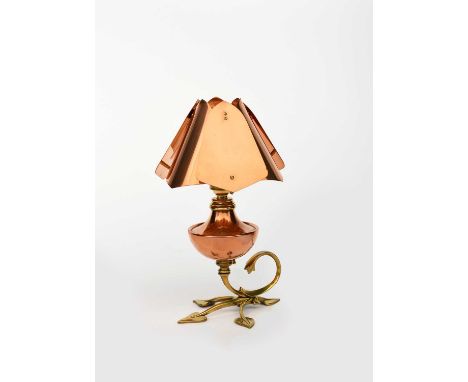 A WAS Benson brass and copper table lamp, model no. 426, the brass tripod foot cast with foliate terminals and scroll handle,