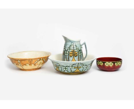 A Mintons Pottery Secessionist wash basin and ewer designed by John Wadsworth and Leon Solon, painted with Art Nouveau flower