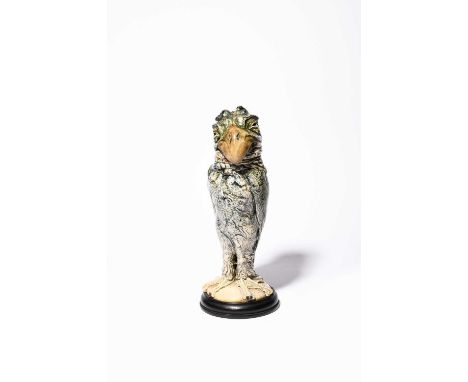 A Martin Brothers stoneware bird jar and cover by Robert Wallace Martin, dated 1905, with claw feet, standing erect with wing