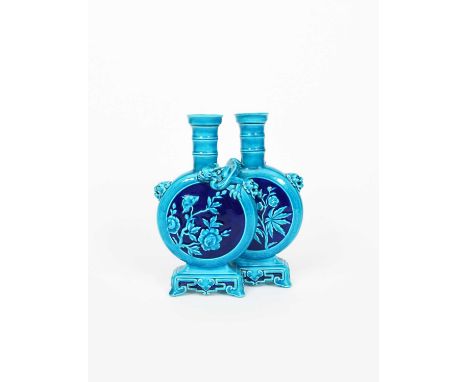 An Aesthetic Movement Mintons Pottery double vase, date code for 1873, model no. 1786, cast as two flattened bottle vases on 