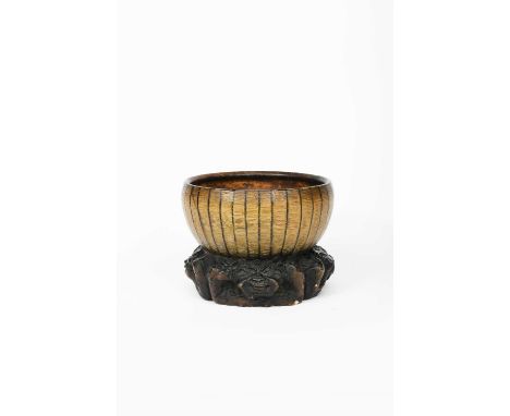 A rare Martin Brothers stoneware Grotesque vase by Robert Wallace Martin, dated 1880, modelled as a bamboo bowl on ebonised b
