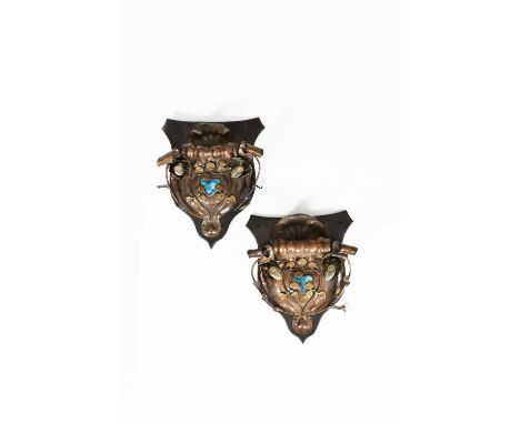 A pair of large patinated metal twin-light wall sconces possibly Birmingham Guild, shield shaped with applied stems of foliag