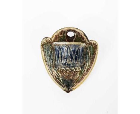 An early Martin Brothers stoneware vesta wall pocket by Robert Wallace Martin, dated 1875, shield shaped back plate with mode