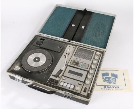 Sanyo Portable Music centre CENTRE model G-2615N-2, contained in a briefcase, the lid opens to form two speakers, with manual