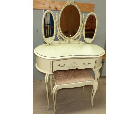 A cream and gilt period style kidney shaped dressing table and stool