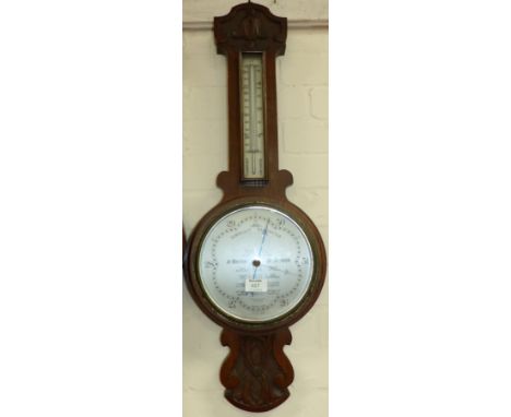 An oak cased aneroid barometer