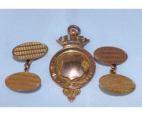 A hallmarked 9 carat gold medallion; a pair of 9 carat hallmarked engine turned cufflinks 