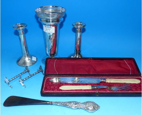 A silver specimen vase with pierced rim, Sheffield 1912, height 7½", inscribed; a pair of silver candlesticks (a.f.); a cased