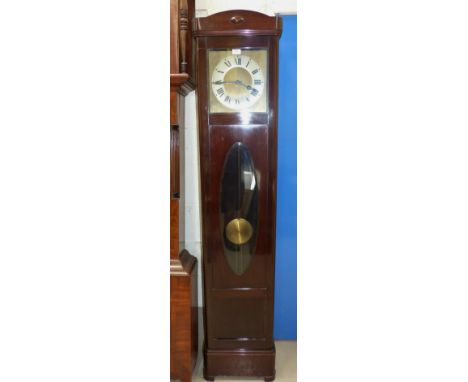 A 1930's mahogany longcase clock with glass door and weight driven chiming movement