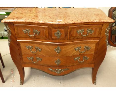 A 19th century Louis XV style serpentine commode chest of 2 long and 2 short drawers, having variegated brown marble top, orn
