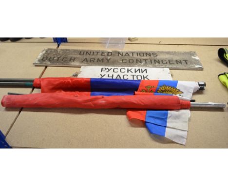 A Soviet flag and three Russian flags, a United Nations Dutch army contingent sign and a Russian area sign (6).