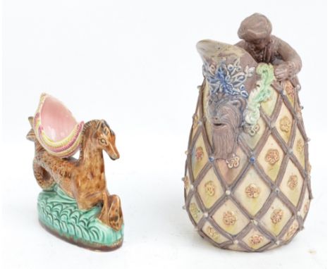 A 19th century majolica glazed salt modelled as a shell upon a hippocampus, length 16.5cm and a Castle Hedingham Royal Essex 