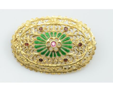 An 18ct yellow gold ruby garnet and green emerald oval pierced brooch, 4.2 x 3cm, approx 10.7g, purchased from Fabio Giorgio 