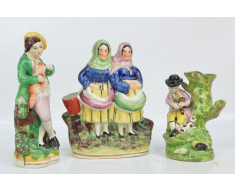 A 19th century Staffordshire figure group of two woman beside a bucket, height 21.75cm, a 19th century Staffordshire figure o