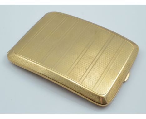 A 9ct yellow gold cigarette case of curved rectangular form, with overall engine turned decoration and Greek key border, hall