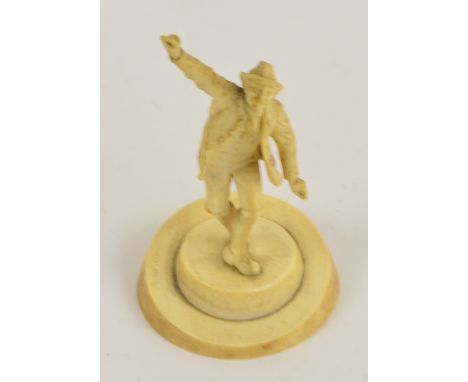 A late 19th/early 20th century German carved ivory figure of a dancing man in traditional clothes, on circular base with insc