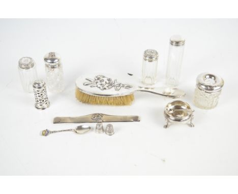 A mixed lot of hallmarked silver items including four dressing table jars, a hair tidy jar, a salt cellar and a matching comb