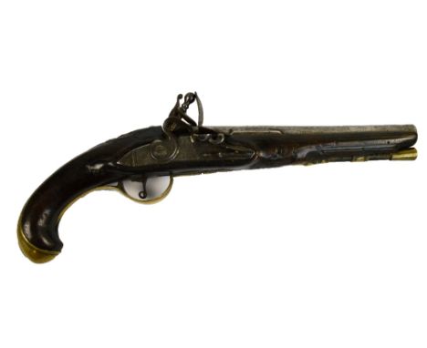 A late 18th/early 19th century Continental flintlock holster pistol with carved decoration to the walnut stick, brass furnitu