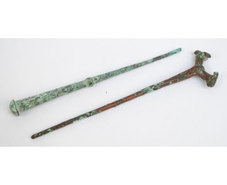 A Roman bronze cloak pin excavated at the Valley of the Kings, length 14.5cm, and an 8th century B.C. Luristan cloak pin, len