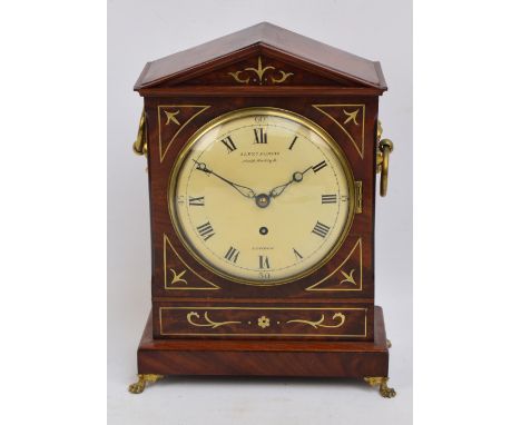 A Regency mahogany and brass inlaid bracket clock, the arched case above painted dial inscribed 'Alexd Purvis, North Audley S