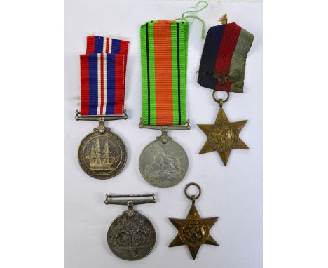 A collection of four WWII medals comprising a War Medal, a Defence Medal and two 1939-1945 Stars, with two ribbons, in a meda