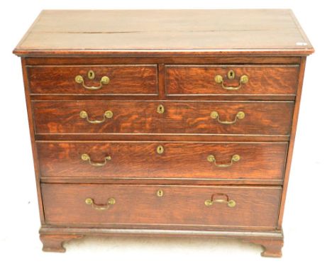 A late George III oak chest of two short and three long graduated drawers raised on ogee bracket feet, width 91cm.   CONDITIO