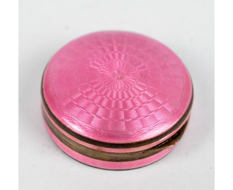 A silver gilt and pink guilloche enamel decorated patch box of circular form, diameter 3.7cm.