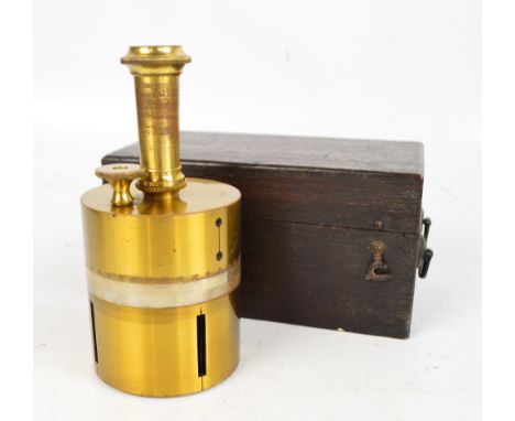 A c.1900 oak cased brass surveyor's cross with compass.